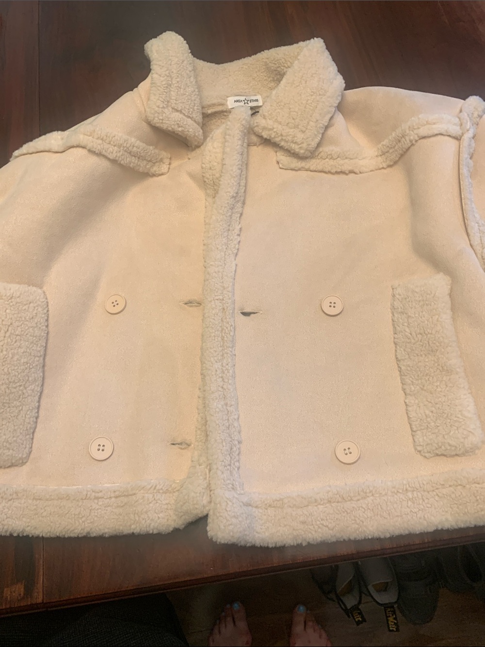 Women’s tagged large but I would say a small to medium would be best cream color